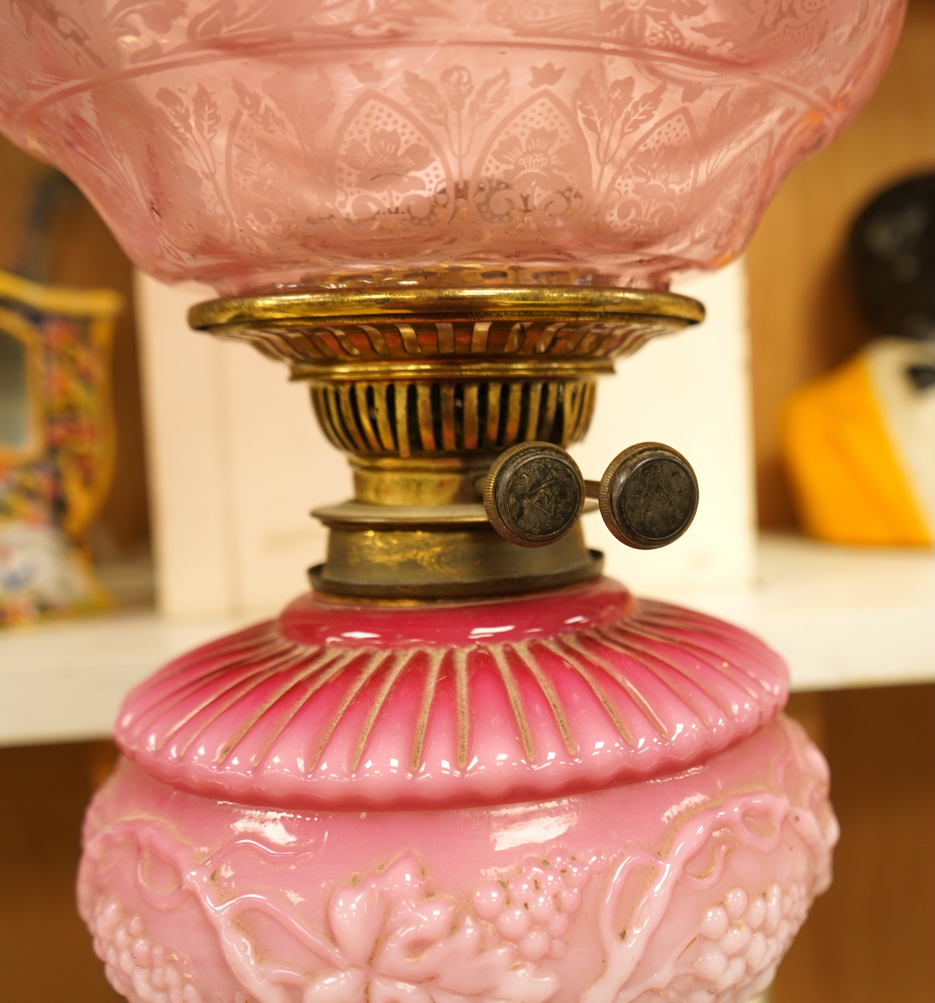 A Victorian brass and ruby glass oil lamp, 80cm high overall